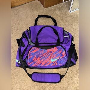 purple, pink, & blue nike duffel bag